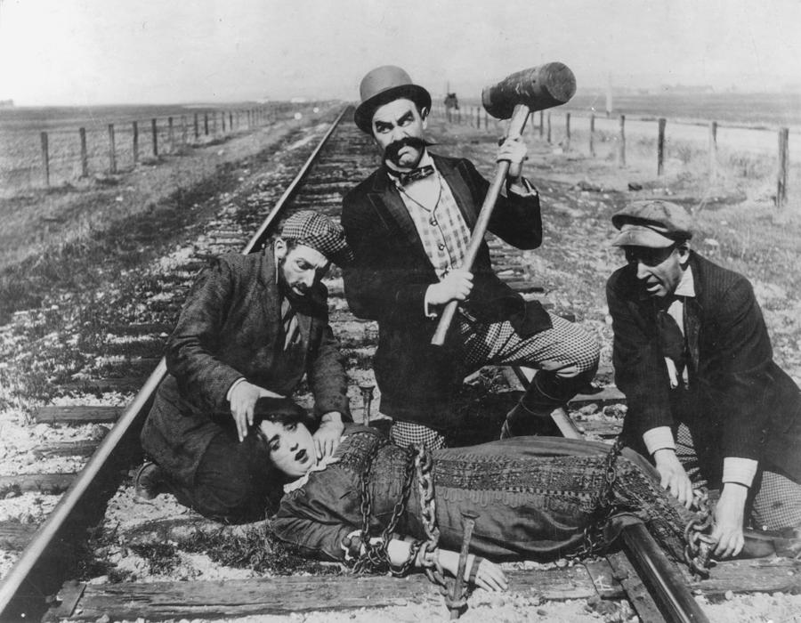 Barney Oldfield's Race for a Life (1913) Keystone comedy starring from l–r) Al St. John, Ford Sterling, Hank Mann, Mabel Normand (chained to railroad track), Mack Sennett (not pictured). silent film parody