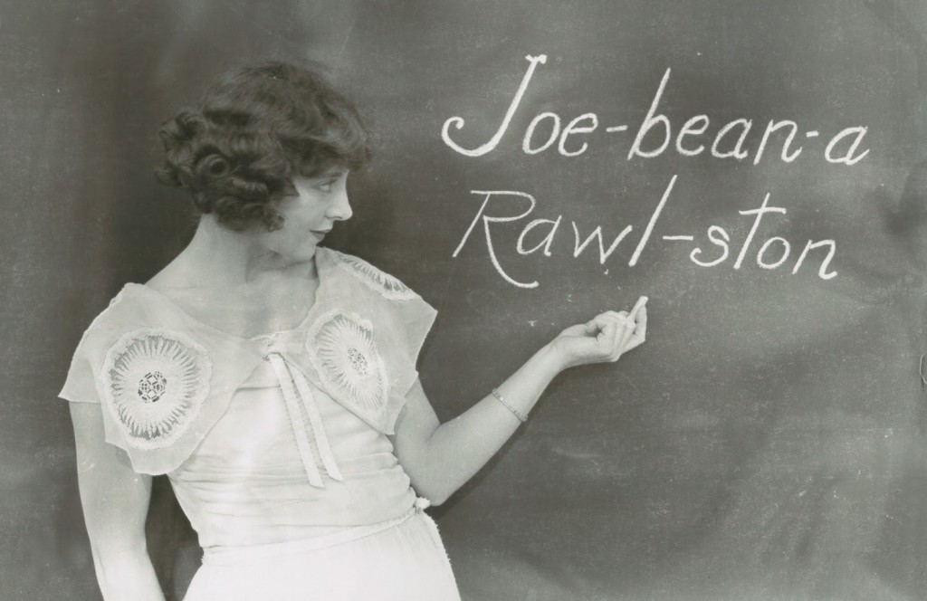 Jobyna Ralston, silent film actress and Harold Lloyd's main leading lady, writing her name phoenetically on a blackboard