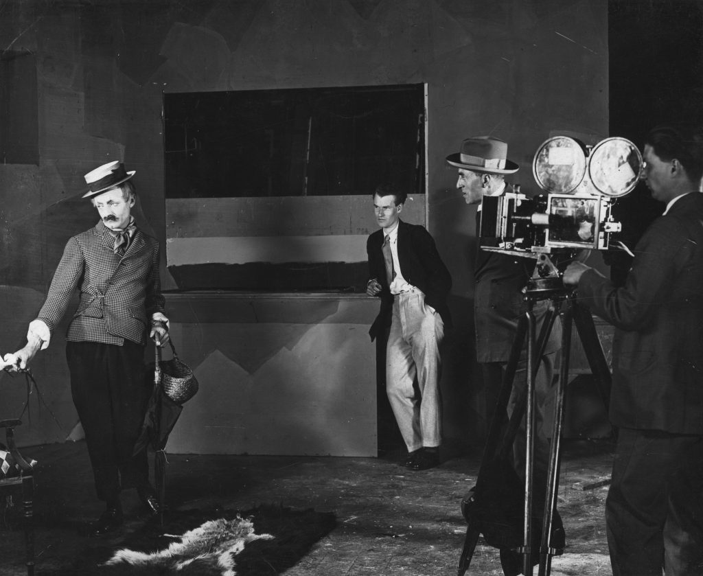 Donald Calthrop (L), Anthony Asquith, A.V. Bramble and cameraman on the set of Shooting Stars (1928)