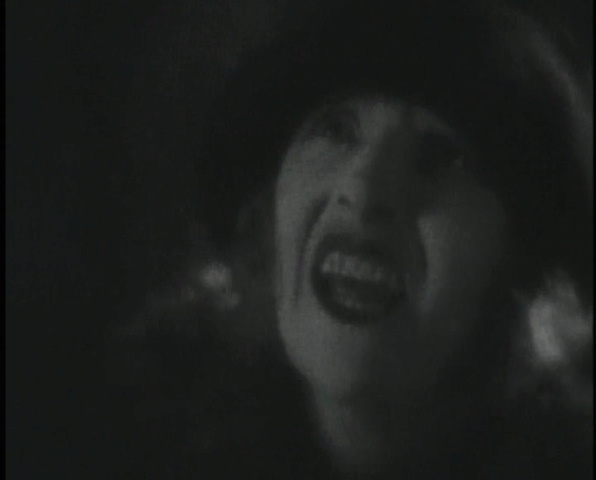 Horror hides in the shadows: Eve Gray is stretched and cropped in The Lodger (1926, dir. Alfred Hitchcock). US St. Clair Vision bootleg DVD screenshot.